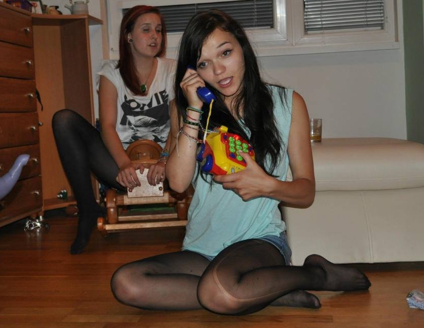 Brunette Teen Girl wearing Black Ripped Sheer Pantyhose